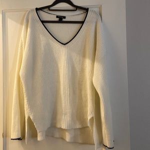 Crème color sweater with black trim